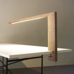 Straight lines, raw wood and high tech to make it shine. Timp is an unusual desk lamp by Lutz Pankow.