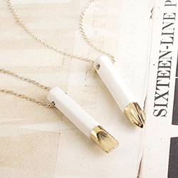 Erica Weiner Porcelain Screwdriver Necklace in collaboration with Amy Hamley, Pittsburgh based ceramicist. Cast in white English porcelain from real 1.25" drill tips. Fired, dipped in 24K gold or platinum luster, then fired again.