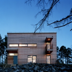 Located on a hill Villa RBDVD has a almost castle feel to it's simple Siberian larch exterior.