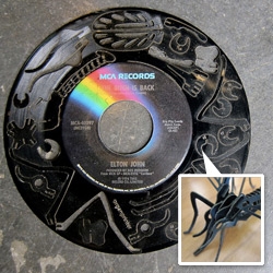 Record Monsters are Laser Cut Vinyl Record Puzzles -- LPs that come pre-cut. You pop out the pieces from a recycled record and make your own sculpture. Music + Art = awesome