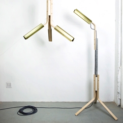 'Branch' modular floor lamp by Rich Brilliant Willing uses bent plywood arms and warm light filters through perforated brass shades. A variety of configurations are achievable.