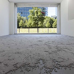 German artist Robert Barta challenges visitors to cross a gallery full of 8mm ball bearings on the floor's surface in his installation 'Crossing Half a Million Stars' currently on view in Berlin.