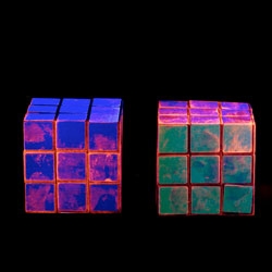 Lorena Turner's Made in China series shows images dusted for fingerprints and photographed under black lights, showing the touch of those who manufactured and packaged each item.