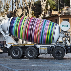 Italian street artist Rub Kandy decorated this cement mixer with hundreds of colored rings using spray cans.