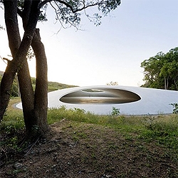 A concrete drop in the middle of the nature, the  Teshima Art Museum by Pritzker laureate Ryue Nishizawa.