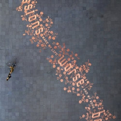 “Obsessions make my life worse and my work better” by Sagmeister Inc. Created completely with euro-cent coins.