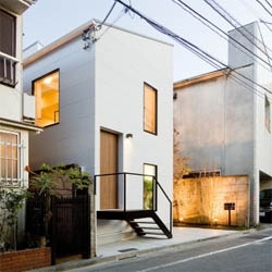 A beauty salon and cafe on a narrow site in  Umeyashiki, Tokyo designed by Upsetters Architecture. Sandwiched between two buildings, the small space is designed a as a retreat full of light.