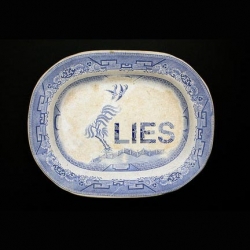 Second hand plates by artist Karen Ryan. By removing the decorative patterns, Karen cover the old plate with new glaze, revealing emotionally raw words that prick our conscience...