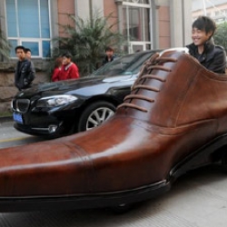 Footwear manufacturer Kang Shoe has made an electric car out of a giant shoe. The two seater can travel 250 miles at speeds of up to 20mph on a single charge of the battery located under the driver's seat.
