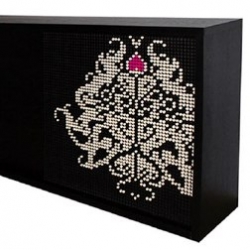 The Bufet Filcowy sideboard has some 4000 holes laid out dot-matrix style. Felt pegs of any hue (not unlike cigarette filters) can be arranged into infinite patterns.