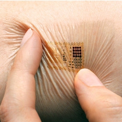 John Rogers, materials scientist from University of Illinois, has created small circuits that stick on your skin with a stamp. 