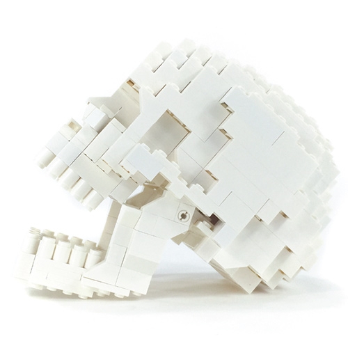 This anatomically correct human LEGO skull  by Felix Jaensch has an articulating lower jaw & even includes one interchangeable gold tooth.