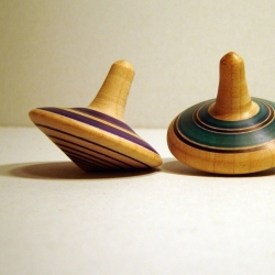 I love the beauty and simplicity of these hand turned  wooden tops by Sleeping Forest Studios.  Available at fawnandforest.com