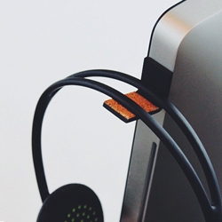 WKRMN has just released an updated version of their original headphone hook.  The Sound Stripp is designed to help free up some much needed desktop real estate by allowing you to hang your headphones off of your monitor. 