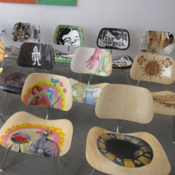 Eames Inspiration. The chairs in molded wood, just like Ray and Charles Eames designed in 1946, are being reimagined by street artists and featured in Barney'ss windows and being sold to raise money for Operation Design.