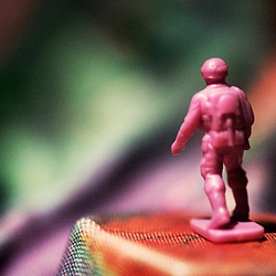 "Strangers in a Strange Land." Macro photography transforms an old children's board game into surreal landscapes.