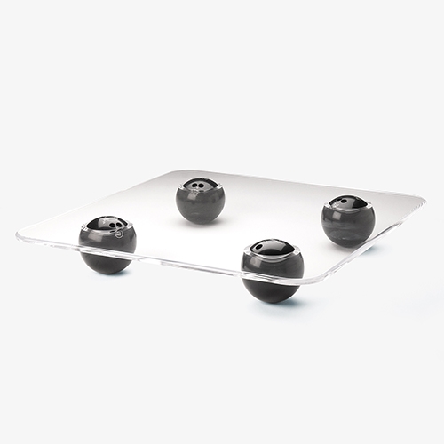 Bowling balls serve as the Strike Table's legs. Designed by James Piatt.