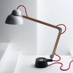 Studioilse w084t is a wood and metal task lamp with a fabric cord. Made in Sweden by Wästberg