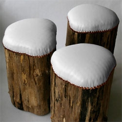 Reminiscent of snow-covered stumps, wood for these stools were harvested from a fallen maple tree. White leather upholstery  and copper tacks over organic latex foam. Small, nearly-invisible feet 'levitate' them ever off the ground.