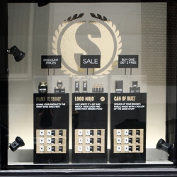 SUPERLUXE, a pop-up window installation promoting a satirical catalog of products that provide customers with a toolkit for instant luxury branding success. The window will be up until May 14th at 74 New Montgomery, SF.
