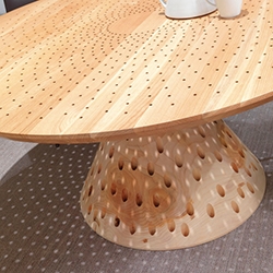 The Colino round table by Michele De Lucchi - this version has series of holes  which create a lovely lighting effect!
