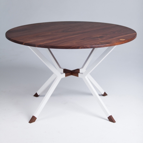The Connector Dining table is a beautiful and functional mix of black walnut and powder coated steel. Designed and crafted by Sean Woolsey in California.