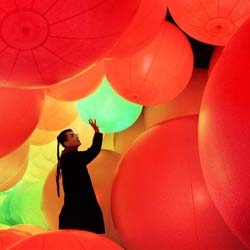 teamLab's interactive installation "Homogenizing and Transforming World" currently at Hong Kong Arts Centre with giant floating balls that react to touch.