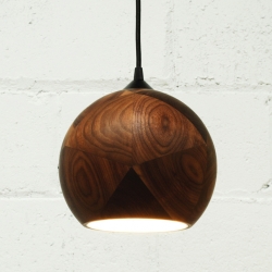 The Dark + Stormy Light by the National Design Collective, is a beautiful pendant globe light, which shows off the natural wood grain in a unique way.  It is named after a delicious rum drink and inspired by Buckminster Fuller.