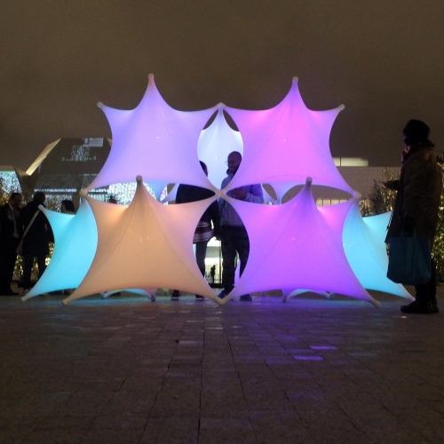 Sparks at Nuit Blanche Toronto 2016, is an interactive sculpture. Inspired by Islamic patterns, Sparks is built out of soft spandex fabric and a girded rigid structure. Inside lights are controlled by remotes so that users can interact and change colors at will. 