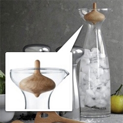Alfredo Haberli Carafe for Georg Jensen ~ the top is literally a wooden spinning TOP! Such an elegant option to work some play into the table setting...