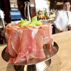 Prosciutto Tower ~ Melon, prosciutto and chunks of Parmesan cheese in a cleverly presented twist on prosciutto e melone at the new Mr. C in Los Angeles.