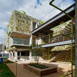 Harmonia 57 is a commercial building designed by Tryptyque, which acts like an ecosystem. Two blocks with a vegetable skin that grows during time, reusing rain water.