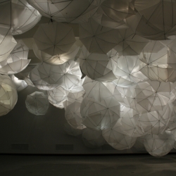 Amazing glowing cloud made from 275 white umbrellas.