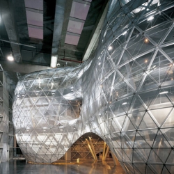 It’s a big bubble inside an existing shell. Vanke Experiment Center is a continuous exhibition space spread out over three levels created by URBANUS.