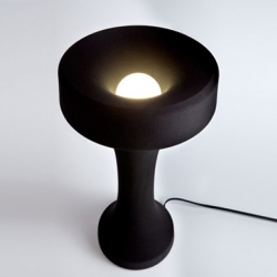 Vega Lamp design by Alice Rosignoli. This lamp is a translation of the general principle of relativity, the fabric is curved under the mass of the bulb.