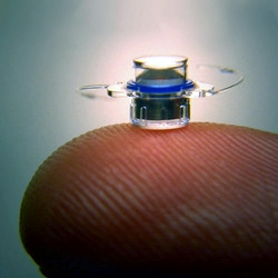 Visioncare's vision improving implantable device. 'Implantable Telescope Technology' incorporates wide-angle micro-optical lenses in a Galilean telescope design.