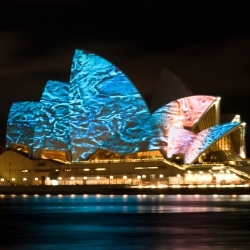 Photos of Vivid Sydney, with art projected on the Opera House and light-related artworks around the city.