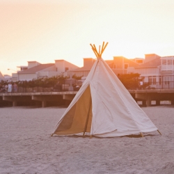 The Wave Wam Teepee by Indoek  is a 10 ounce cotton canvas tent that is ideal for relaxing, reading, or even sleeping at the beach.
