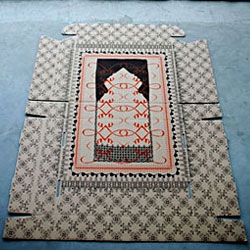 Message in a box by Wendy Plomp, prints intricate rug patterns on cardboard boxes. 