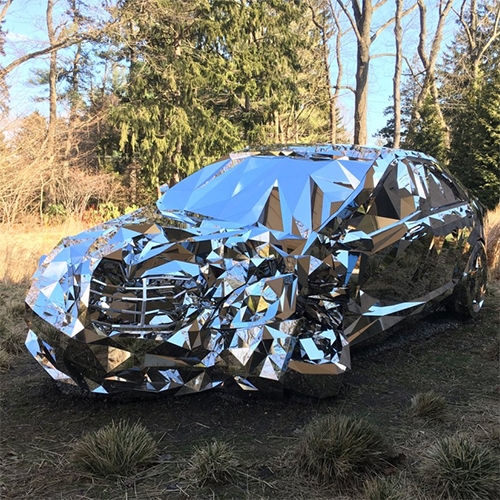 Jordan Griska’s ‘Wreck’ Sculpture is based on a computer-generated model of a luxury sedan, in a video game made of 12,000 individual pieces of mirror-finish stainless steel.
