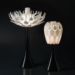 Designed by Patrick Jouin, the Bloom.MGX light has an articulated shade that can be opened or closed like a flower, 