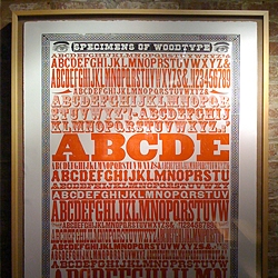 Yee-Haw Industrial Letterpress and Design Co graces the walls and pipes of Chelsea Market, NYC in their latest exhibition