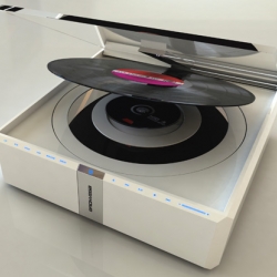 The Zero.1 a is CD player that also plays vinyl records. It features programmable memory for vinyl, letting you play tracks from a record with a remote control, like you would with a CD.